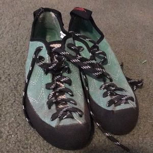 Green rock climbing shoes.